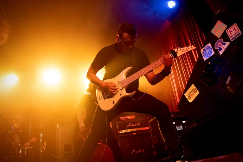 AL Javier of BLOODFATE playing guitar live on stage