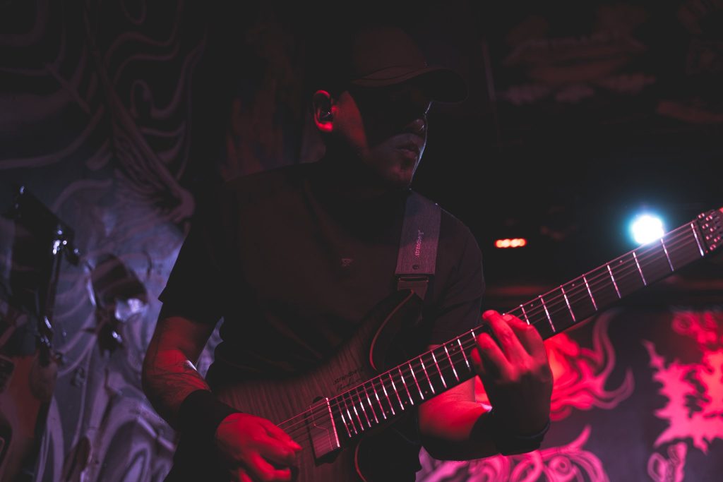 AL Javier playing guitar live with BLOODFATE