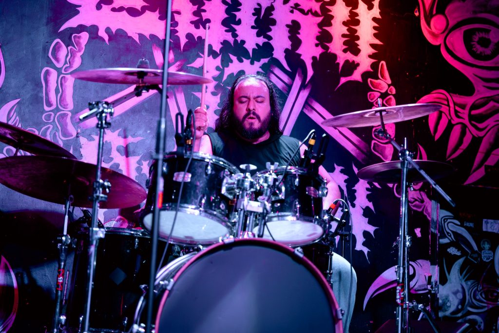 Carlos Crowcell playing drums live with BLOODFATE