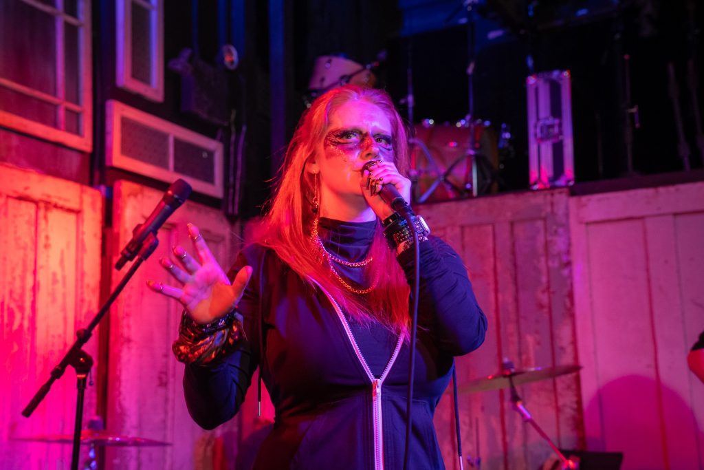 Emilie Bienne of BLOODFATE singing live on stage