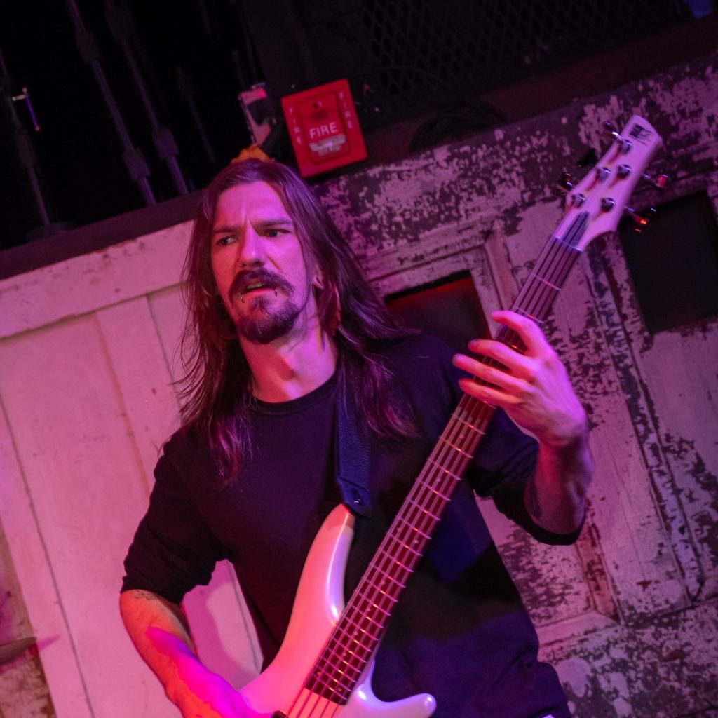 Philippe, bassist of BLOODFATE, playing his bass live in New York